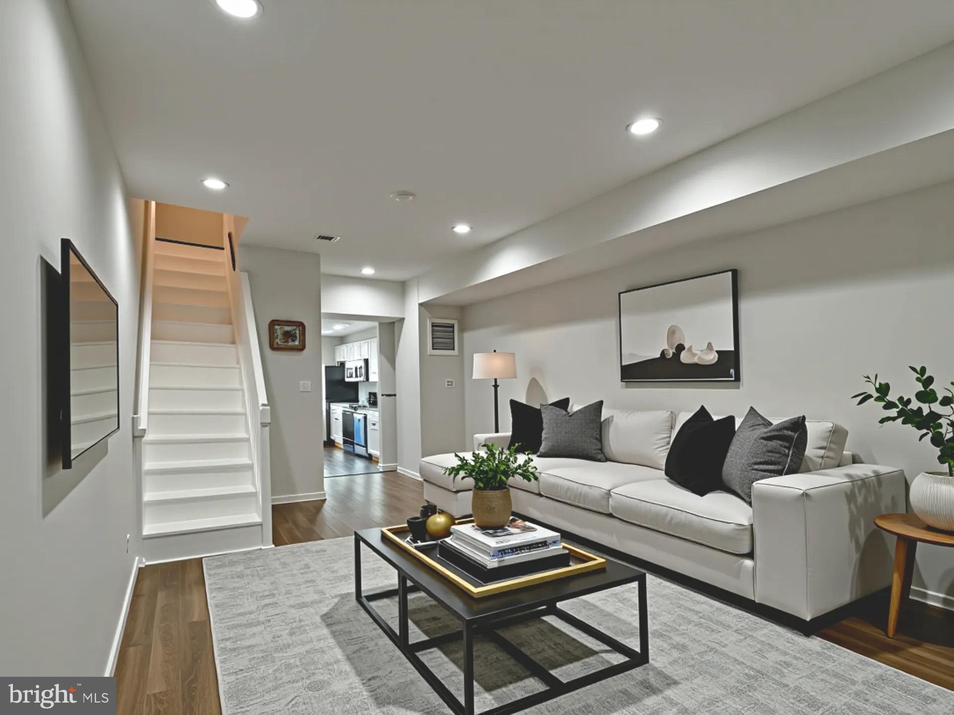 2114 Cliftwood Avenue Baltimore, MD 21213 - Photo 17 of 58 a living room with furniture and wooden floor