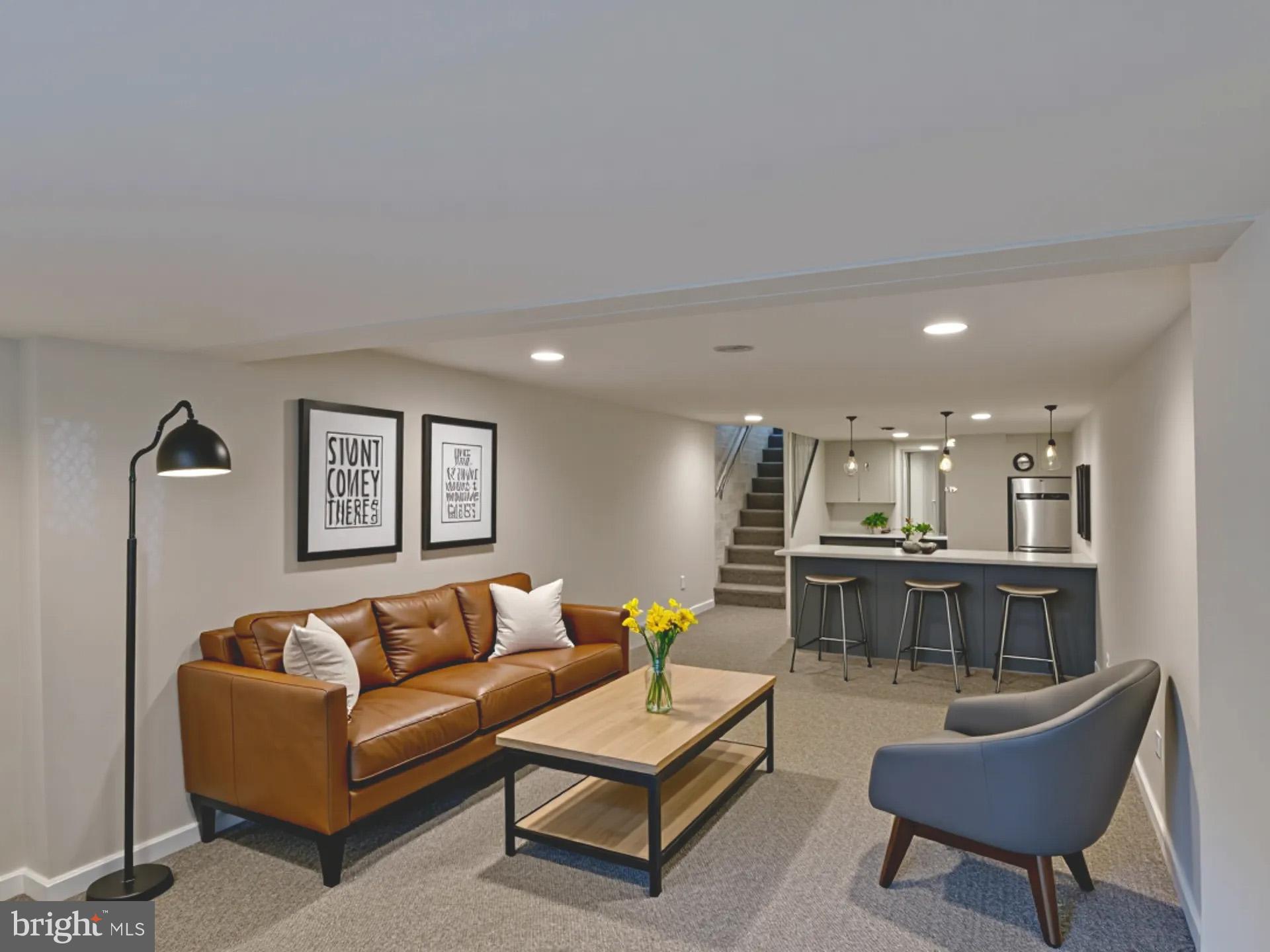 2114 Cliftwood Avenue Baltimore, MD 21213 - Photo 22 of 58 a living room with furniture and a dining table