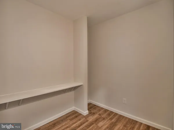 a bedroom with a bed and a table