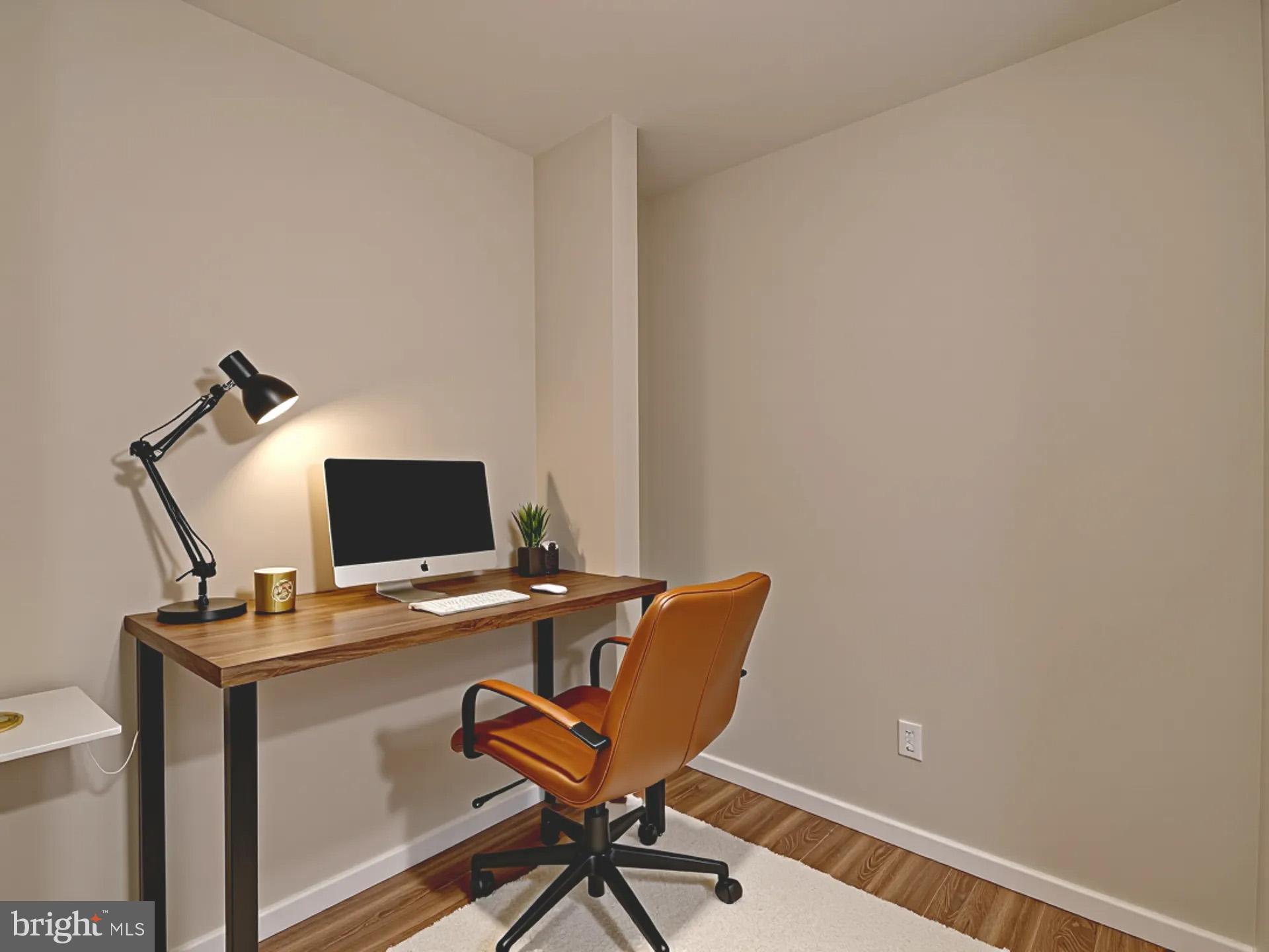 2114 Cliftwood Avenue Baltimore, MD 21213 - Photo 39 of 58 a view of a workspace with furniture and wooden floor