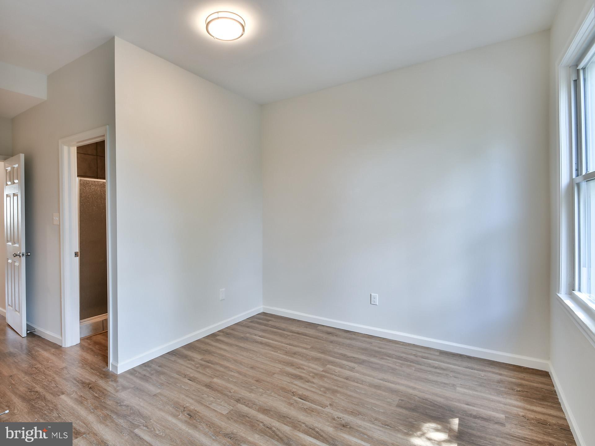 2114 Cliftwood Avenue Baltimore, MD 21213 - Photo 43 of 58 wooden floor in an empty room