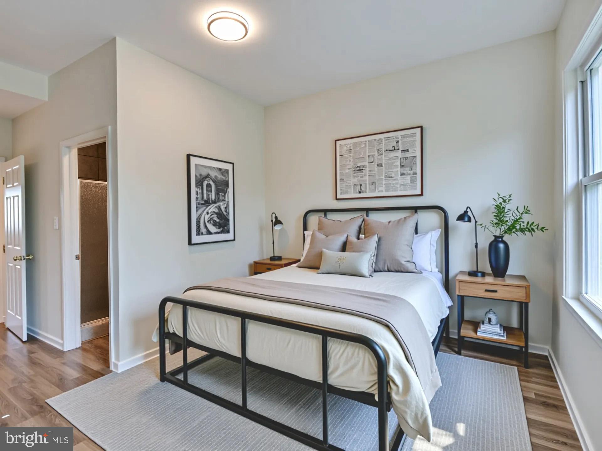 2114 Cliftwood Avenue Baltimore, MD 21213 - Photo 44 of 58 a bedroom with a bed and a table