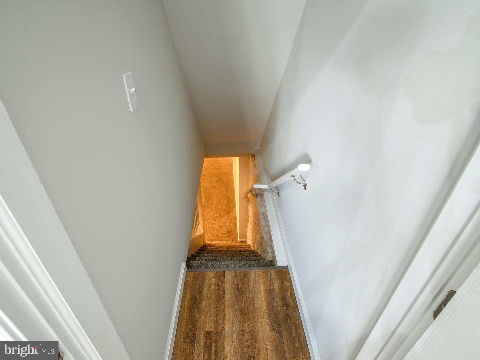 2114 Cliftwood Avenue Baltimore, MD 21213 - Photo 51 of 58 a view of hallway with wooden floor