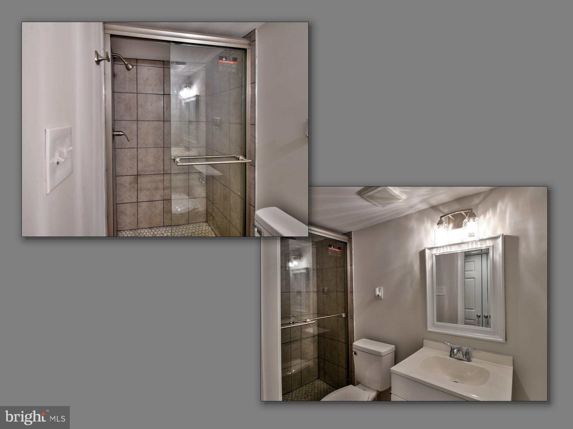 2114 Cliftwood Avenue Baltimore, MD 21213 - Photo 57 of 58 a view of a bathroom with mirror on the shower