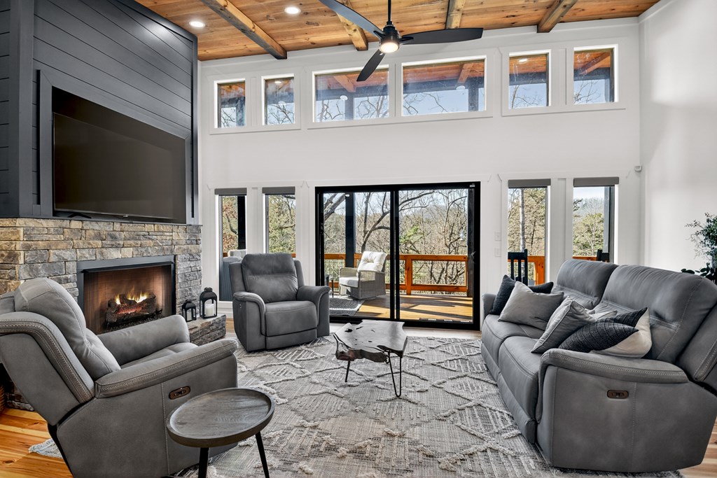 238 Hooch Holler Lane Morganton, GA 30560 - Photo 17 of 49 a living room with furniture or outdoor view and a fireplace