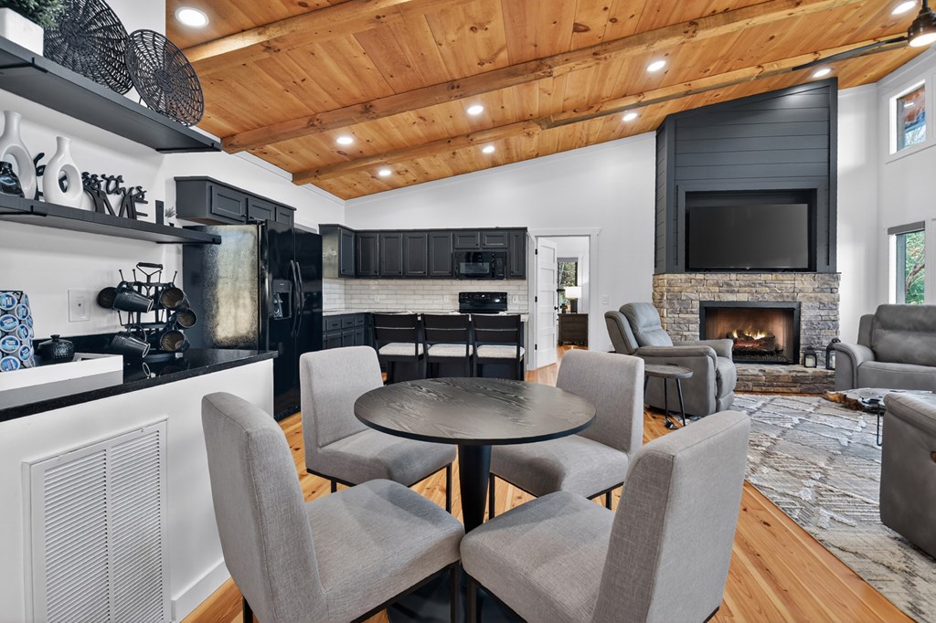 238 Hooch Holler Lane Morganton, GA 30560 - Photo 21 of 49 a living room with stainless steel appliances furniture a fireplace and a flat screen tv