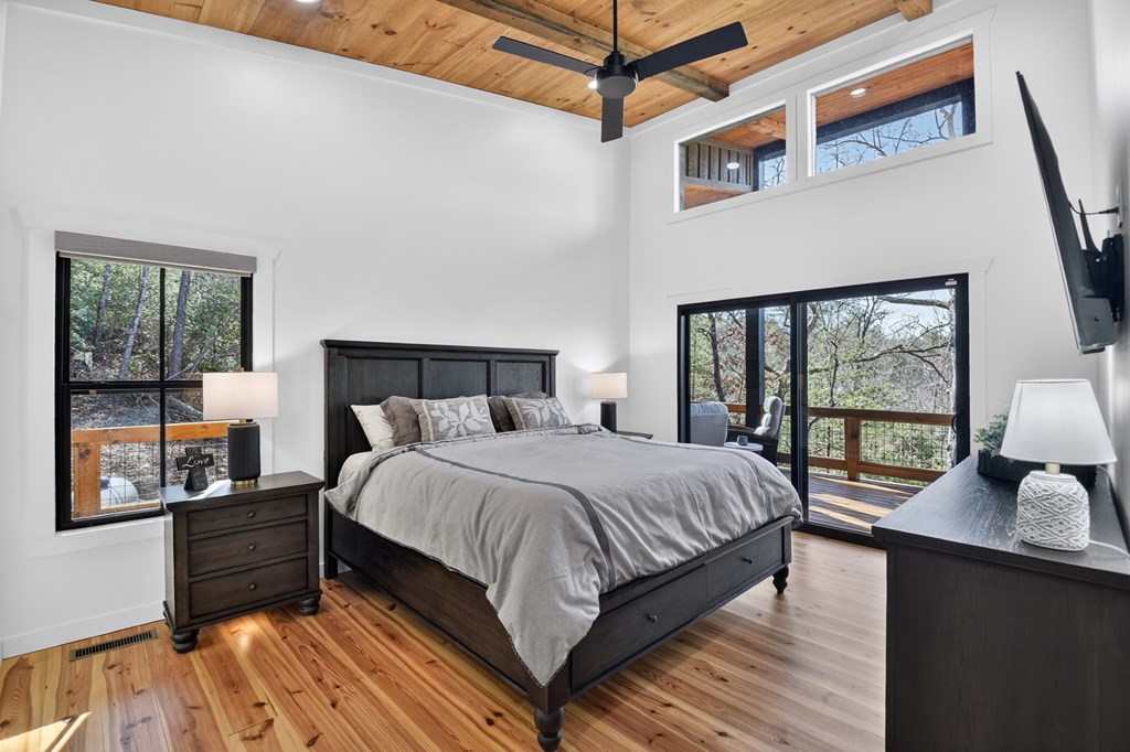 238 Hooch Holler Lane Morganton, GA 30560 - Photo 32 of 49 a large bed sitting in a bedroom next to a window