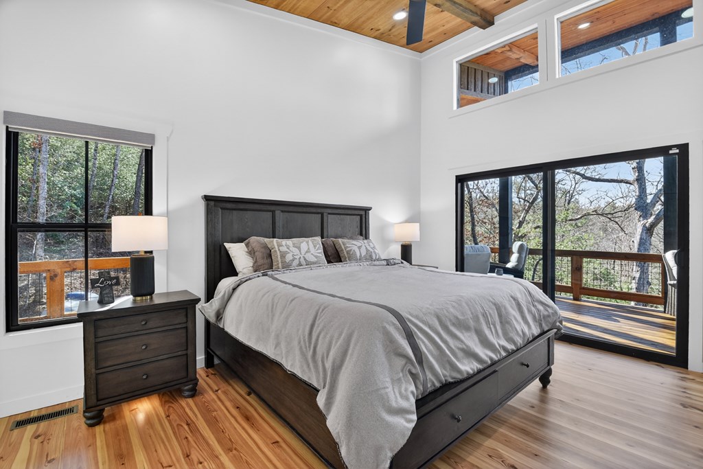 238 Hooch Holler Lane Morganton, GA 30560 - Photo 33 of 49 a bedroom with a bed and window