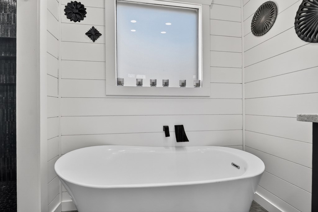 238 Hooch Holler Lane Morganton, GA 30560 - Photo 36 of 49 a bathroom with a white tub and vanity