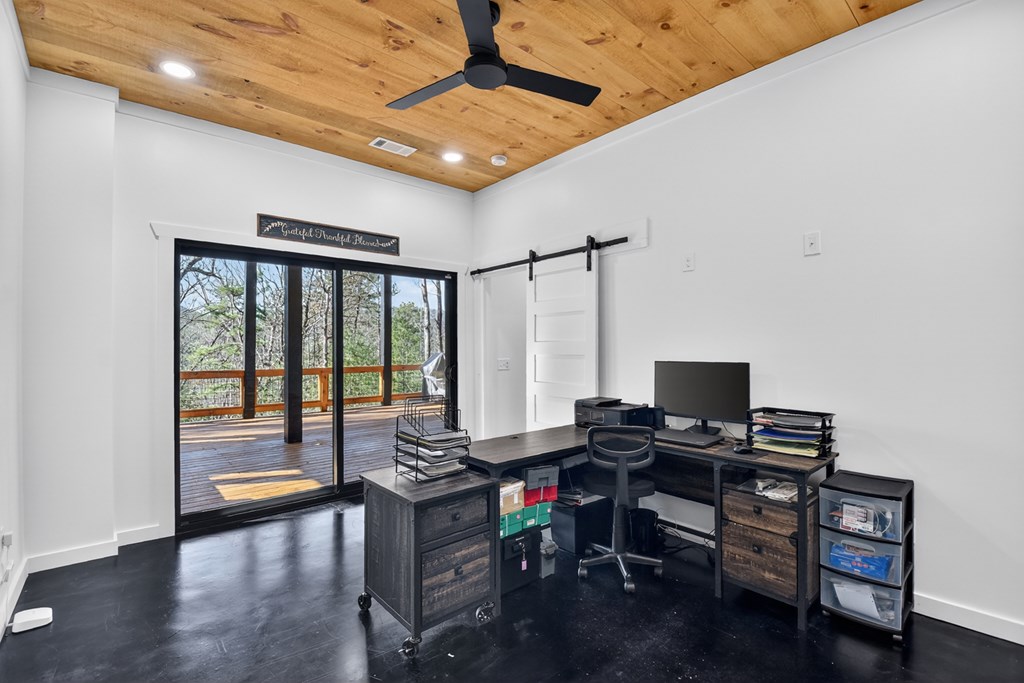 238 Hooch Holler Lane Morganton, GA 30560 - Photo 44 of 49 a work room with furniture and wooden floor