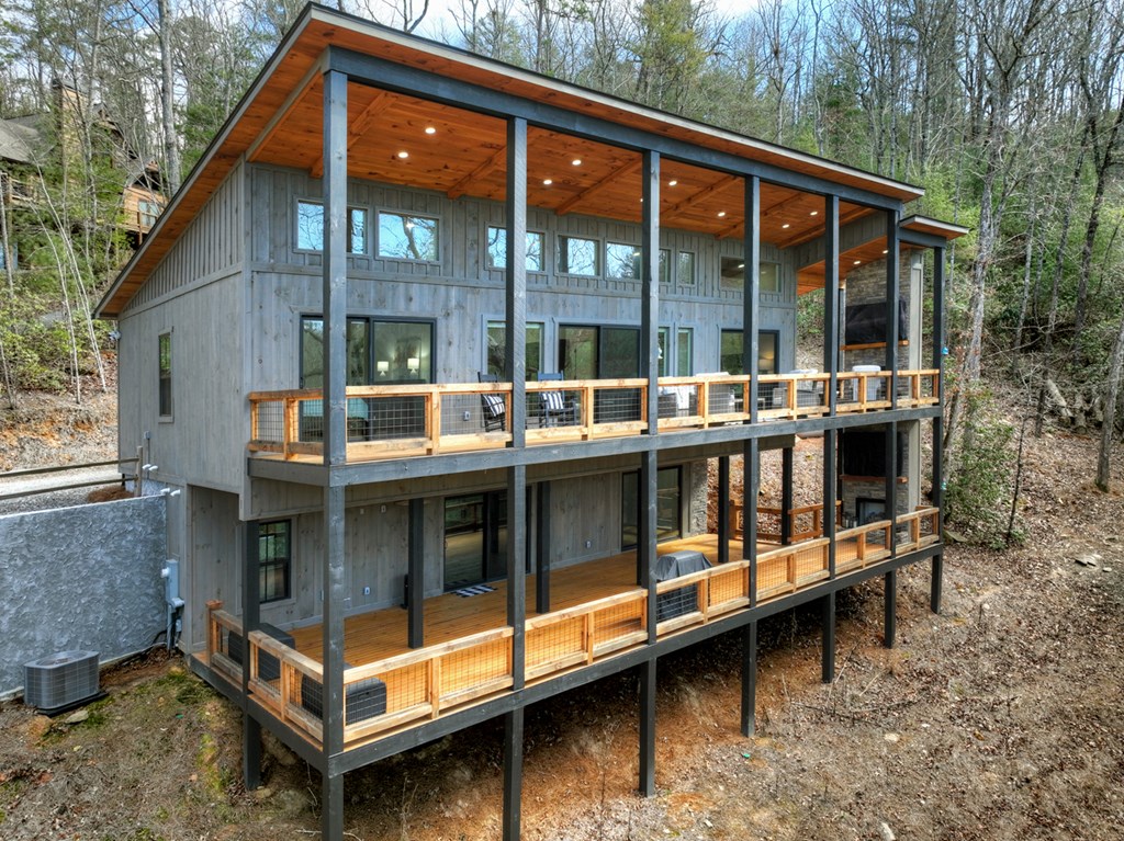 238 Hooch Holler Lane Morganton, GA 30560 - Photo 5 of 49 a view of a white house with a large window and sitting area