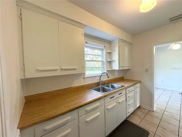 a kitchen with a sink and cabinets