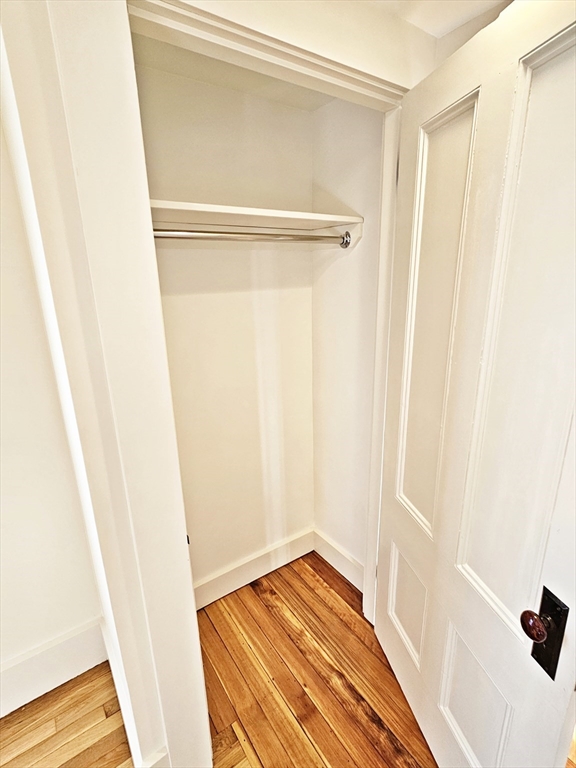 11 Channing Street, Unit 2 Newton, MA 02458 - Photo 16 of 33 a view of a room with wooden floor and a door
