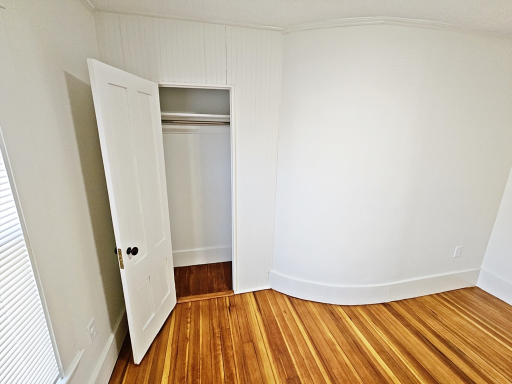 11 Channing Street, Unit 2 Newton, MA 02458 - Photo 23 of 33 a view of a room with wooden floor and entryway