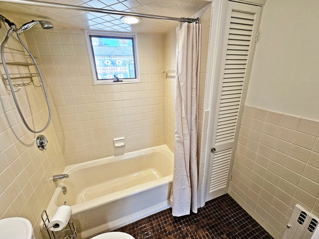 11 Channing Street, Unit 2 Newton, MA 02458 - Photo 25 of 33 a bathroom with a sink a toilet and shower