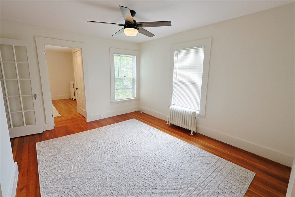 11 Channing Street, Unit 2 Newton, MA 02458 - Photo 31 of 33 a bedroom with a bed and a window