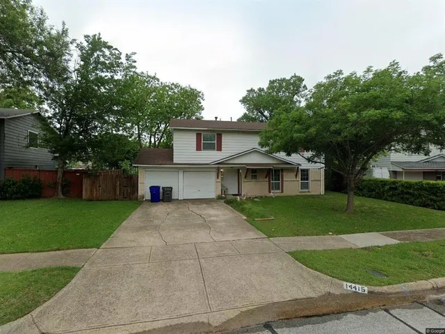 front view of a house and a yard