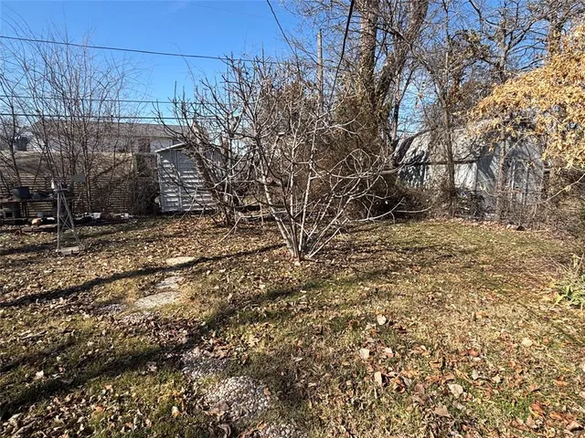 a backyard of a house with lots of green space
