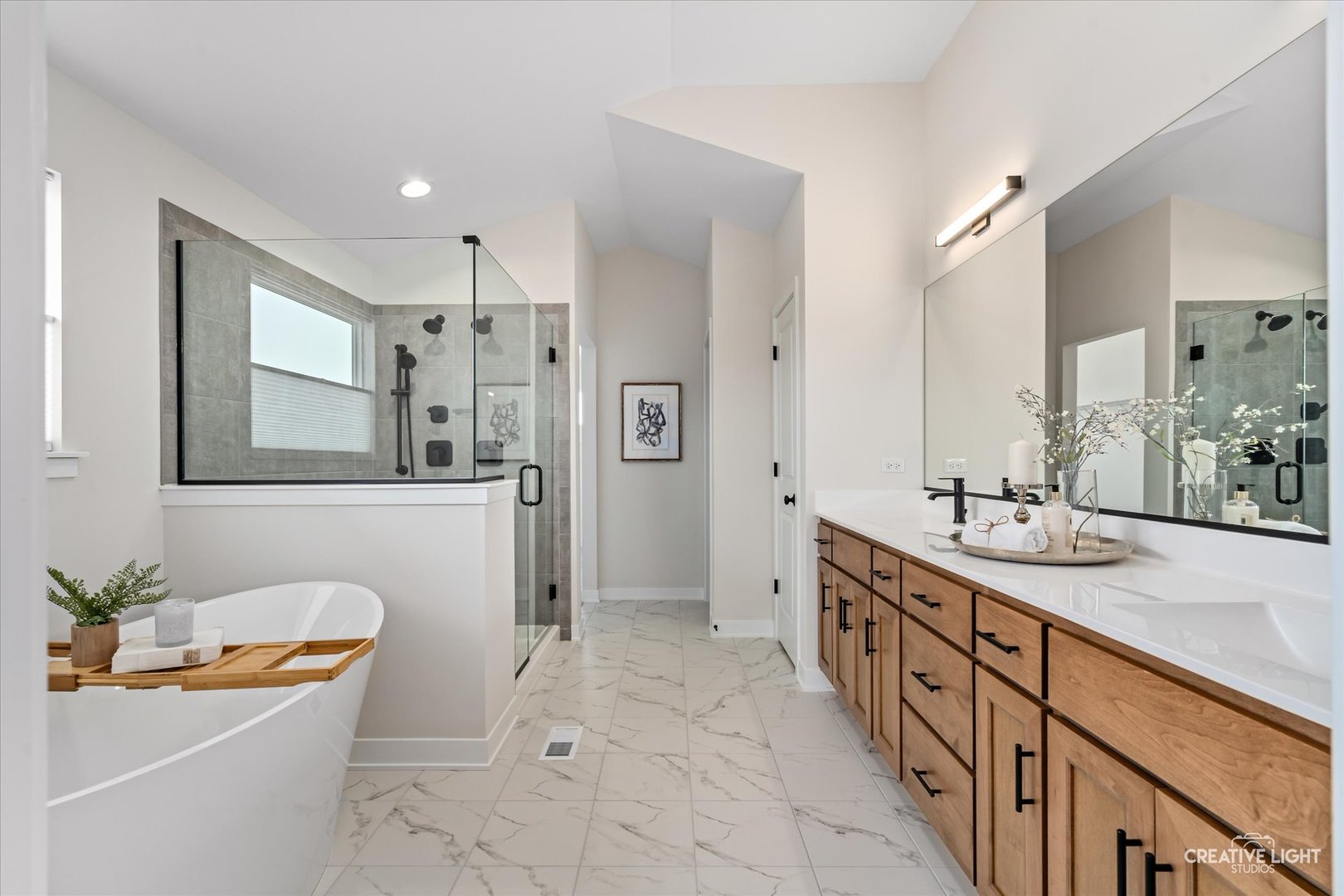3959 Caliente Circle Naperville, IL 60564 - Photo 16 of 28 a spacious bathroom with a sink mirror double vanity and tub