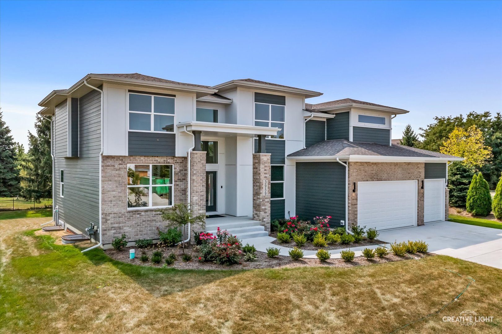 3959 Caliente Circle Naperville, IL 60564 - Photo 2 of 28 a front view of a house with a yard