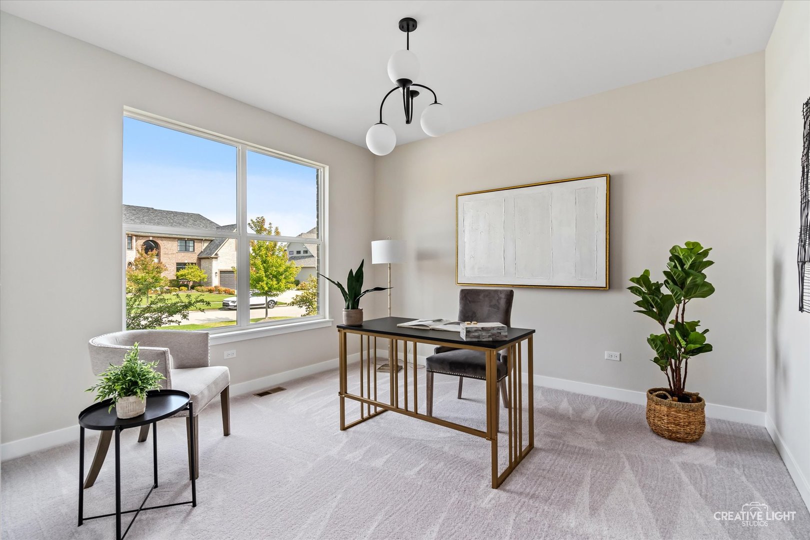 3959 Caliente Circle Naperville, IL 60564 - Photo 24 of 28 a view of a work space with furniture and a potted plant
