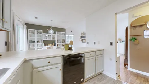 a kitchen with a sink and cabinets