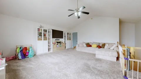a view of livingroom with furniture and flat screen tv