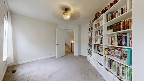 a view of an empty room with shelves