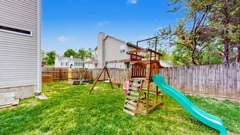 a view of a backyard with a slide