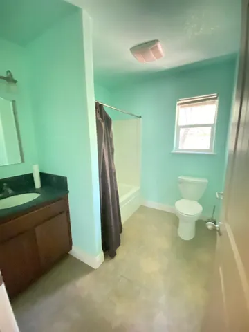 a bathroom with a toilet and a sink