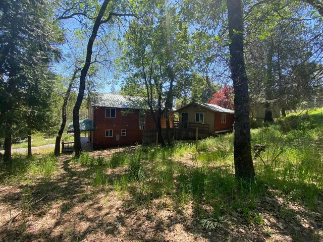 a house view with a backyard space