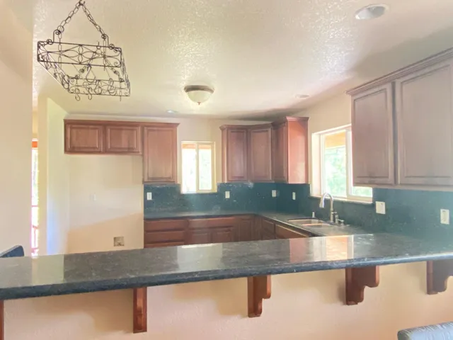 a kitchen with a sink and a window