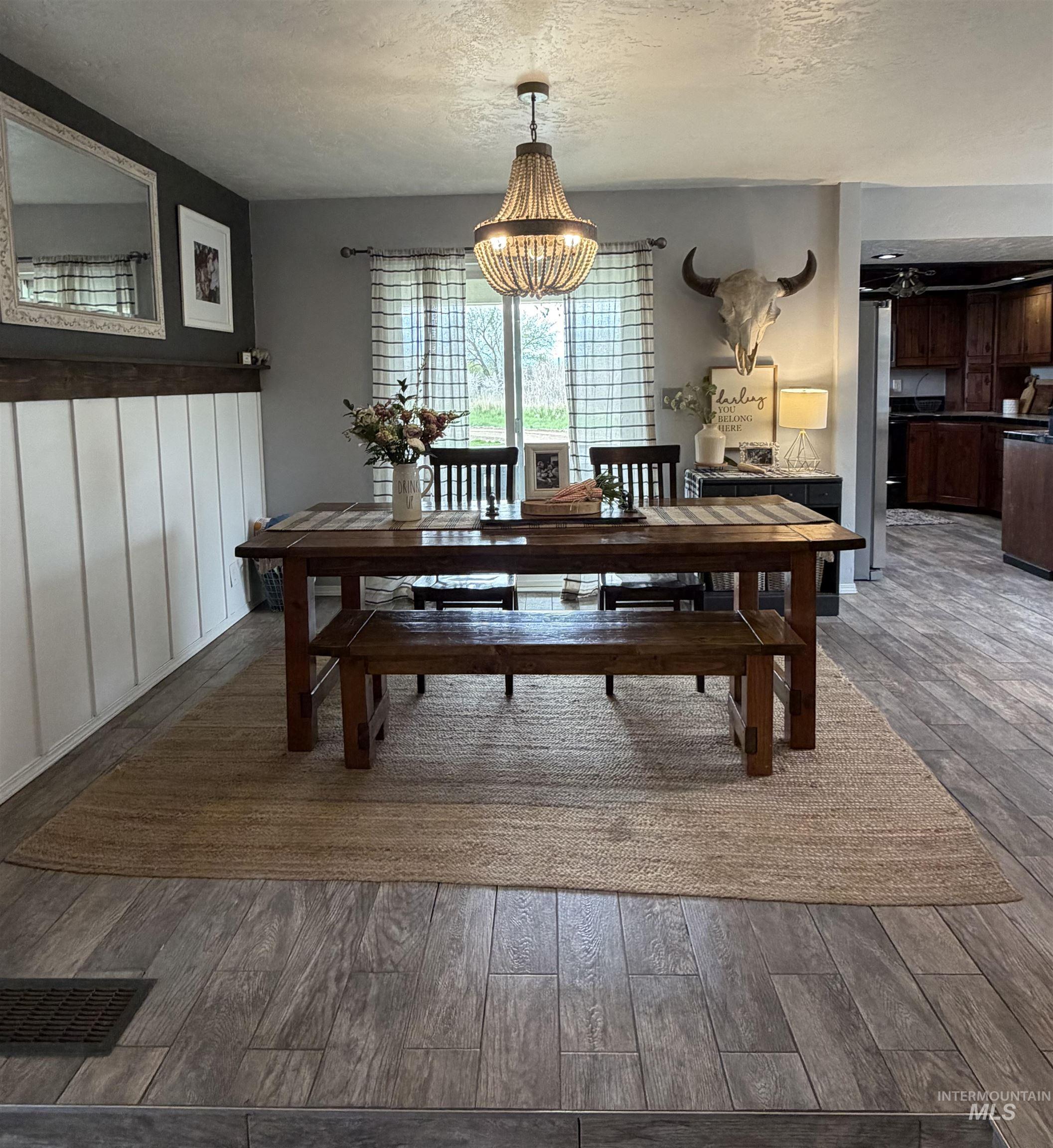 1452 Weiser River Road Weiser, ID 83672 - Photo 7 of 40 Dining area featuring dark wood-type flooring and a textured ceiling