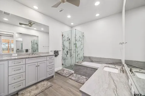 a bathroom with a toilet sink and shower