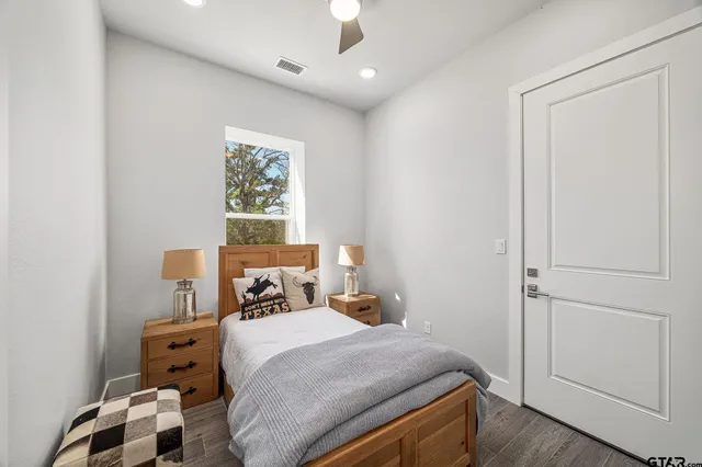 a bedroom with a bed and a window