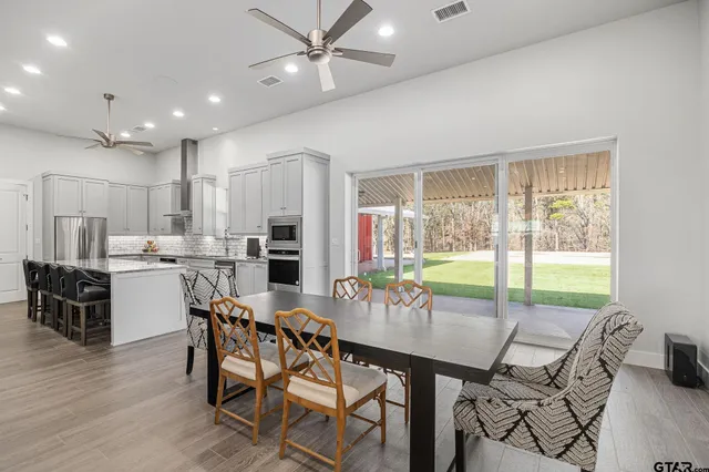a view of a dining room with furniture window and outside view