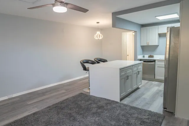 a kitchen with a stove and a refrigerator