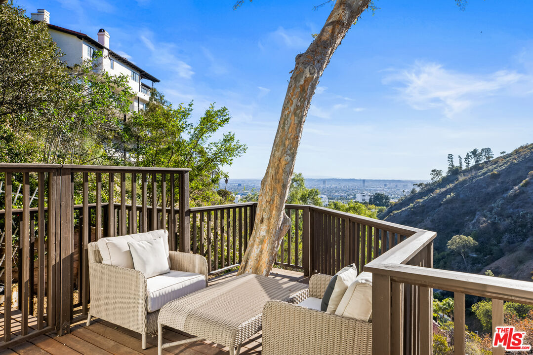 2201 Malaga Road Los Angeles, CA 90068 - Photo 18 of 51 a view of a chair and table on the deck