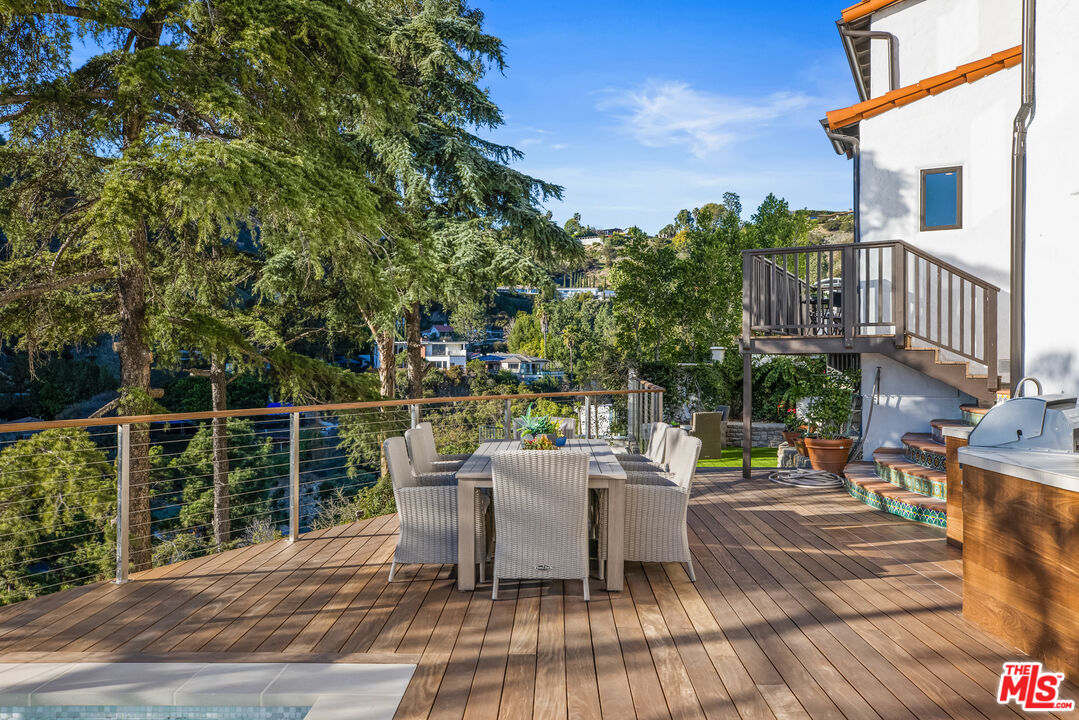 2201 Malaga Road Los Angeles, CA 90068 - Photo 24 of 51 a view of a patio with couches table and chairs and potted plants
