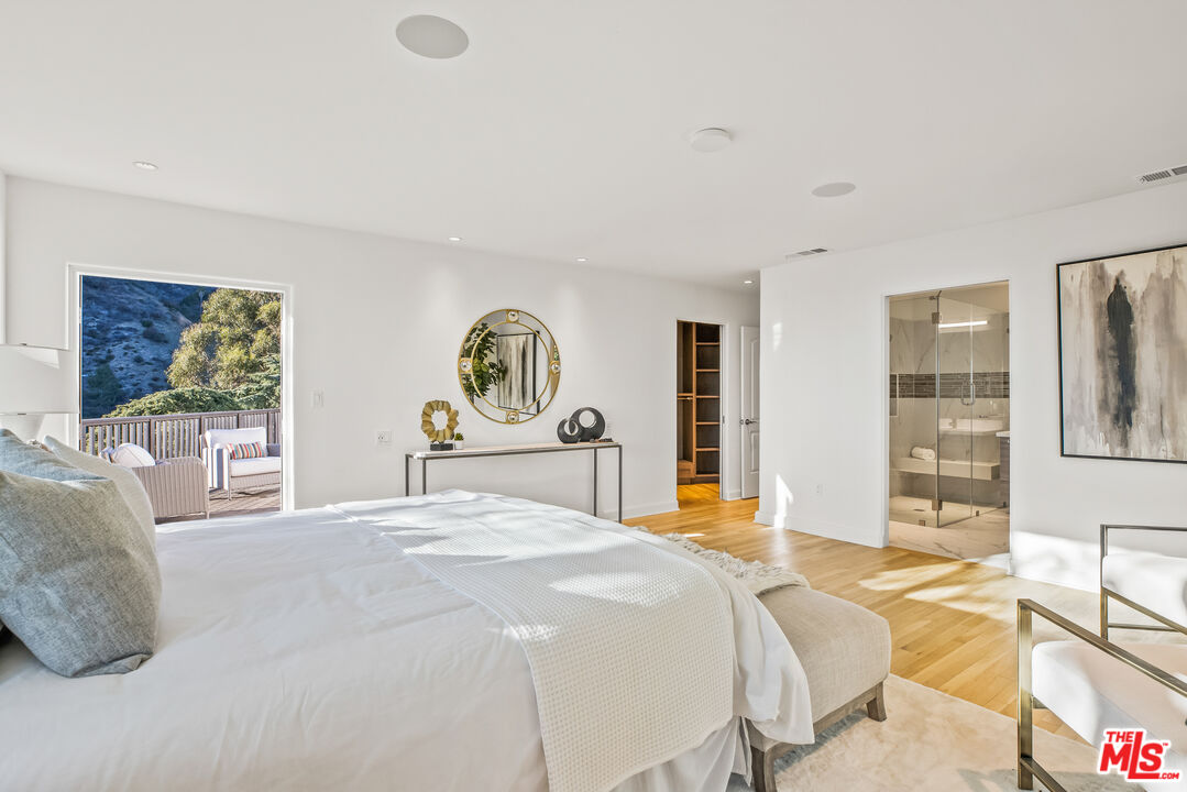 2201 Malaga Road Los Angeles, CA 90068 - Photo 31 of 51 a bedroom with a bed a table and chair