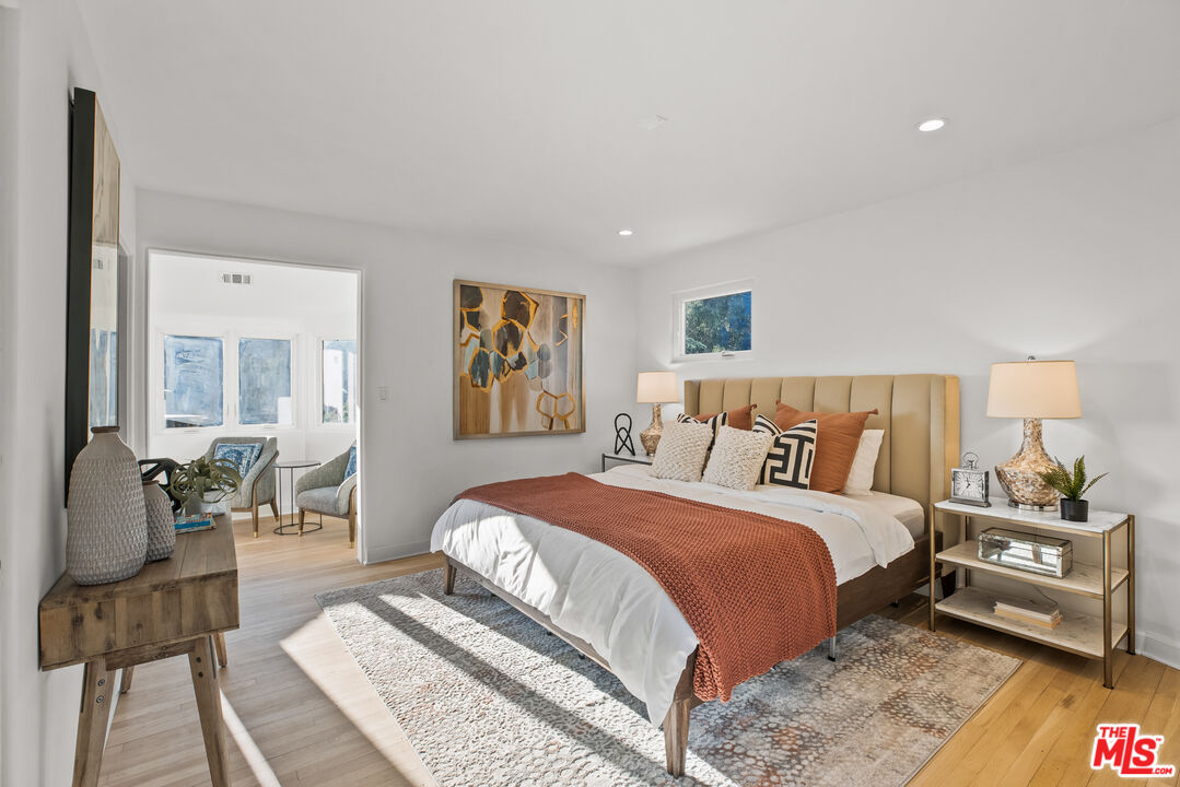 2201 Malaga Road Los Angeles, CA 90068 - Photo 43 of 51 a bedroom with a bed and wooden floor