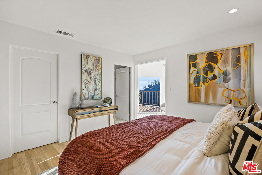 2201 Malaga Road Los Angeles, CA 90068 - Photo 44 of 51 a bedroom with a bed and painting on the wall