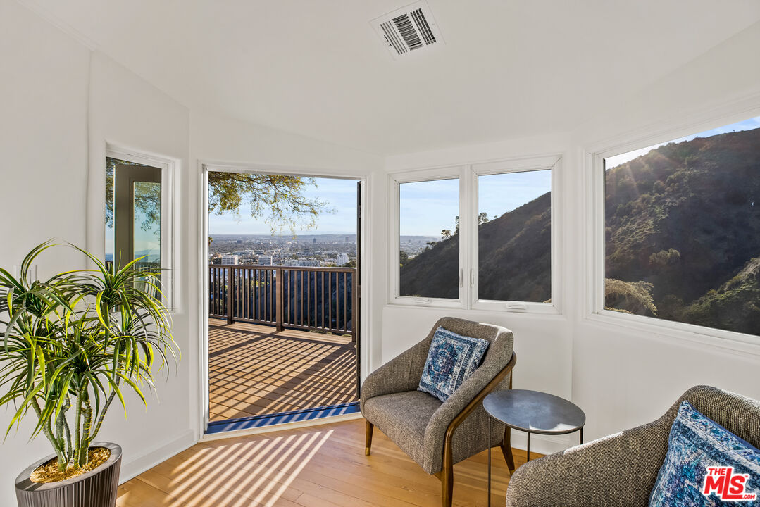 2201 Malaga Road Los Angeles, CA 90068 - Photo 45 of 51 a living room with furniture and a floor to ceiling window