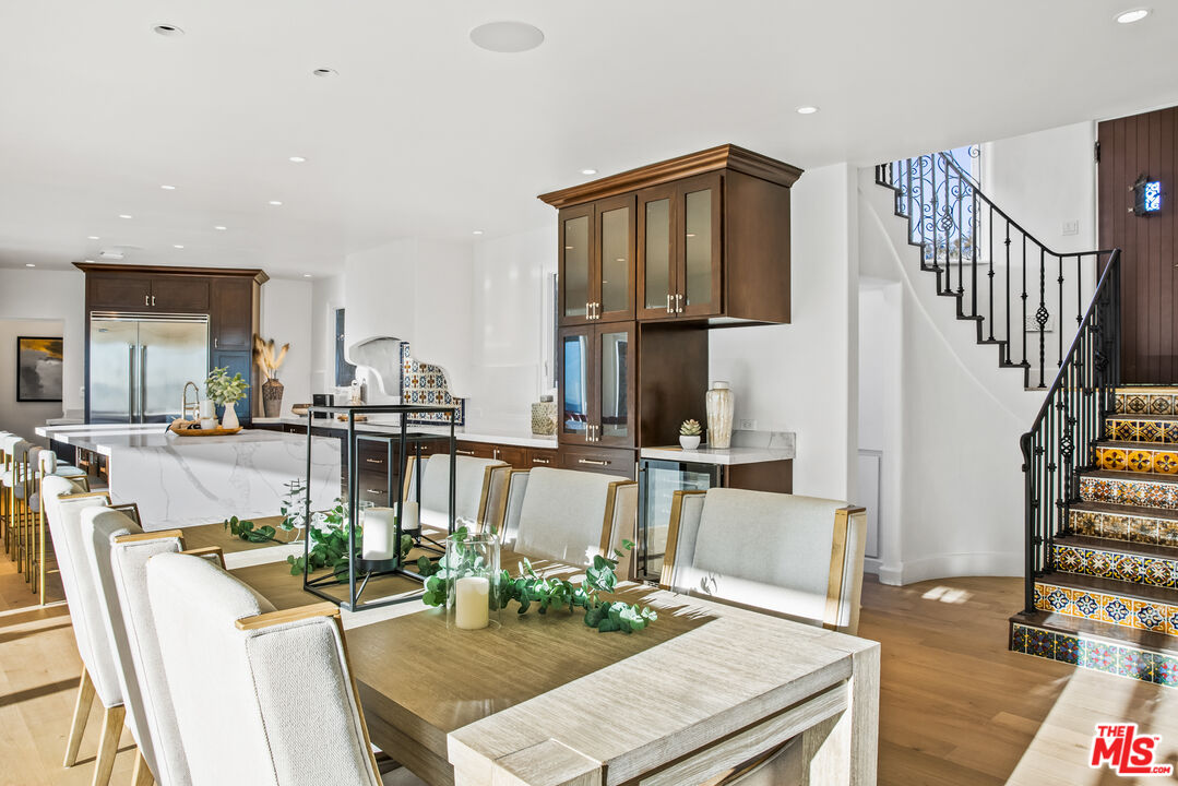 2201 Malaga Road Los Angeles, CA 90068 - Photo 6 of 51 a view of a dining room with furniture a rug and wooden floor