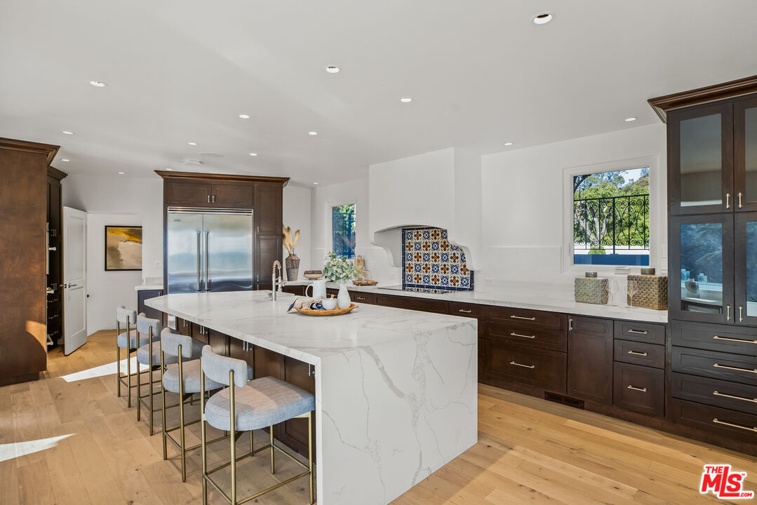 2201 Malaga Road Los Angeles, CA 90068 - Photo 8 of 51 a kitchen with granite countertop a sink and cabinets