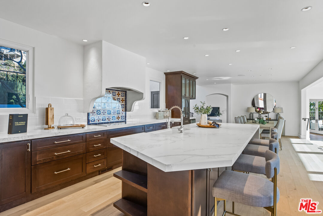 2201 Malaga Road Los Angeles, CA 90068 - Photo 9 of 51 a view of kitchen island a sink and living room