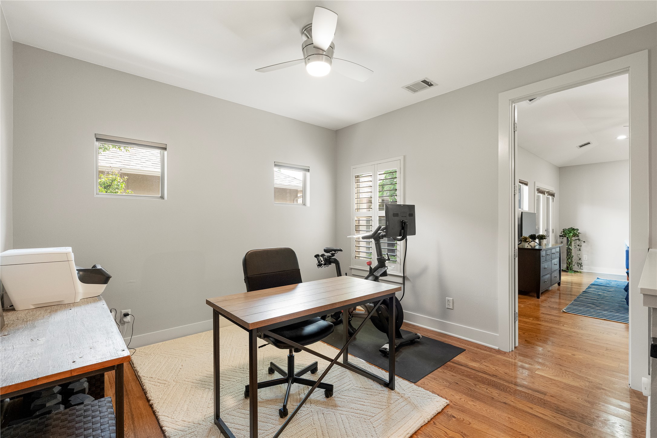 3814 Ridgelea Drive, Unit A Austin, TX 78731 - Photo 18 of 30 a workspace with furniture and wooden floor