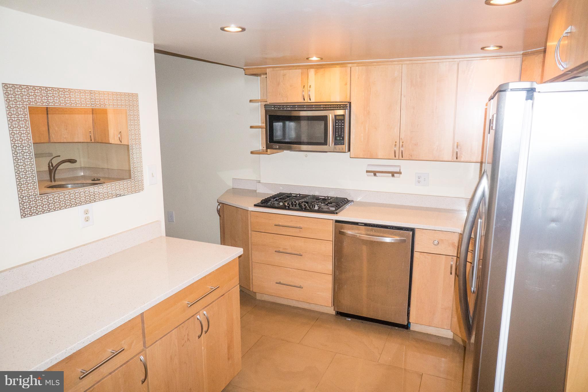 1413 Northgate Square, Unit 1C Reston, VA 20190 - Photo 3 of 16 Spacious Open Kitchen w Updated Cabinets