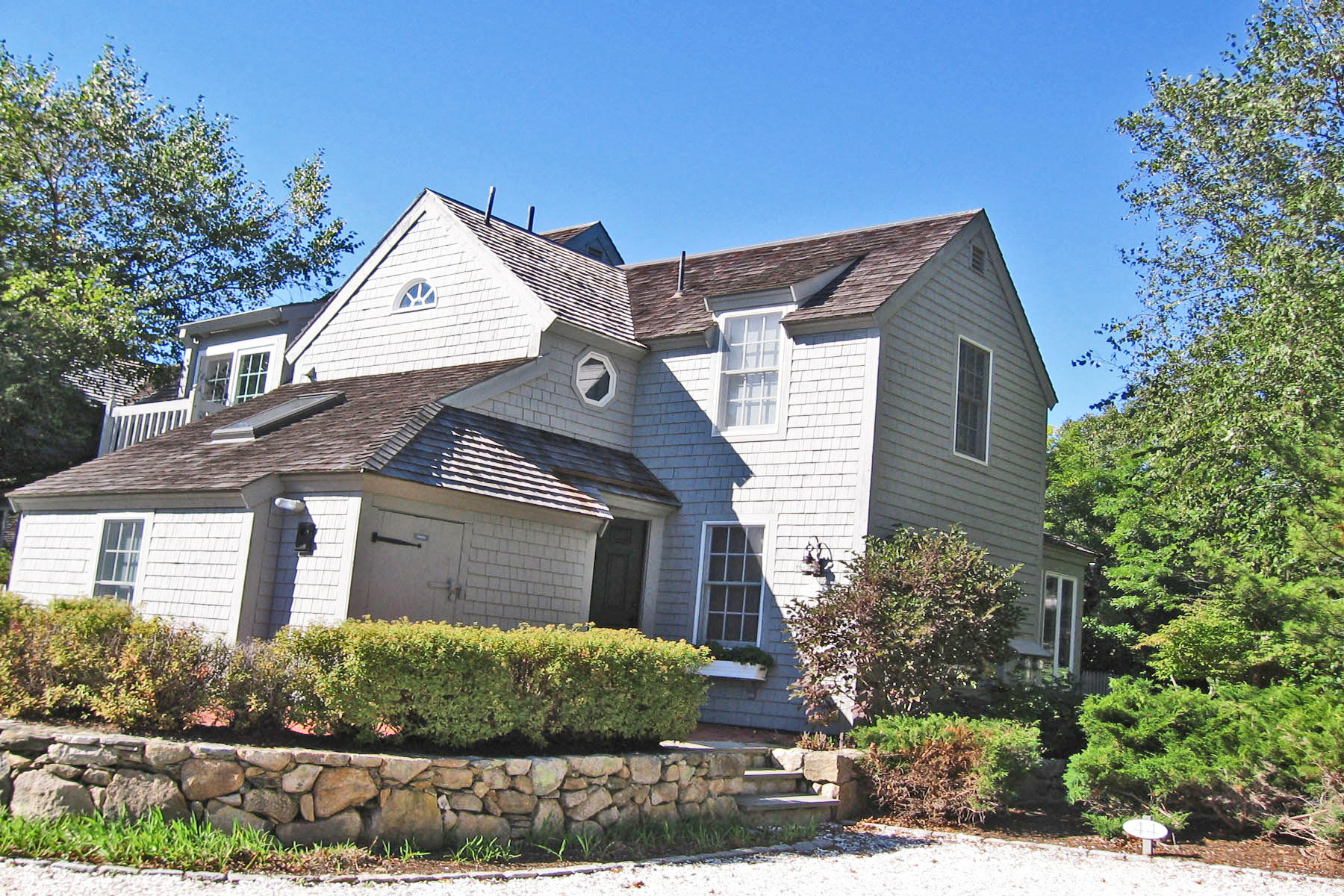 44 Brant Rock Road Mashpee, MA 02649 - Photo 1 of 22 a front view of a house with a yard
