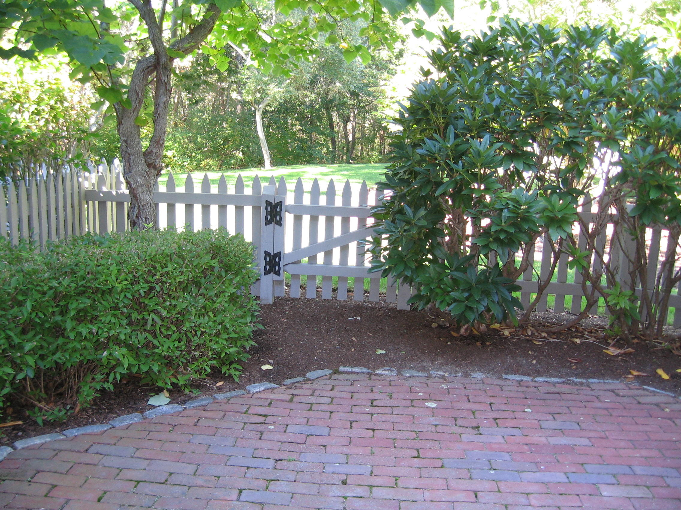 44 Brant Rock Road Mashpee, MA 02649 - Photo 12 of 22 a view of a yard with plants and large trees